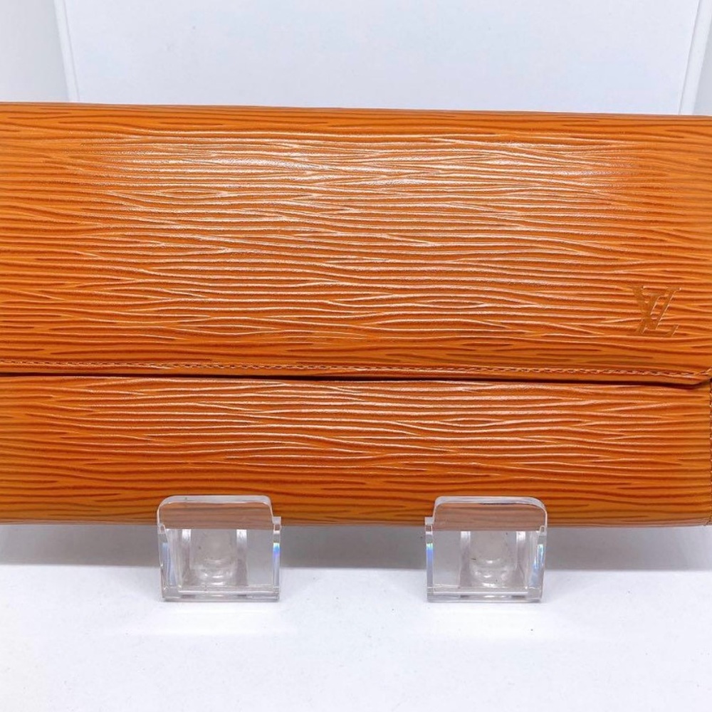 Louis Vuitton Textured Orange Wristlet